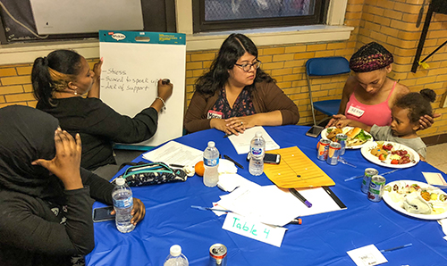 HCAN woman talking in group