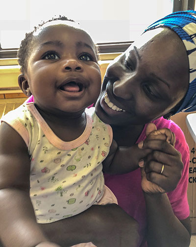 Mom and baby smiling